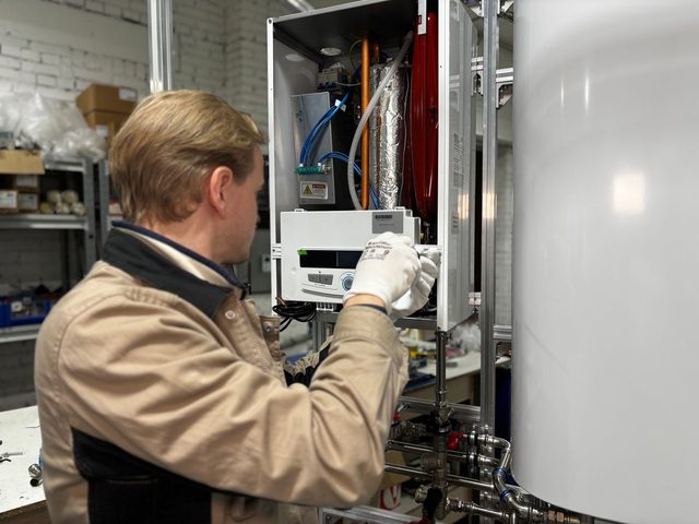 Technician servicing a heating unit