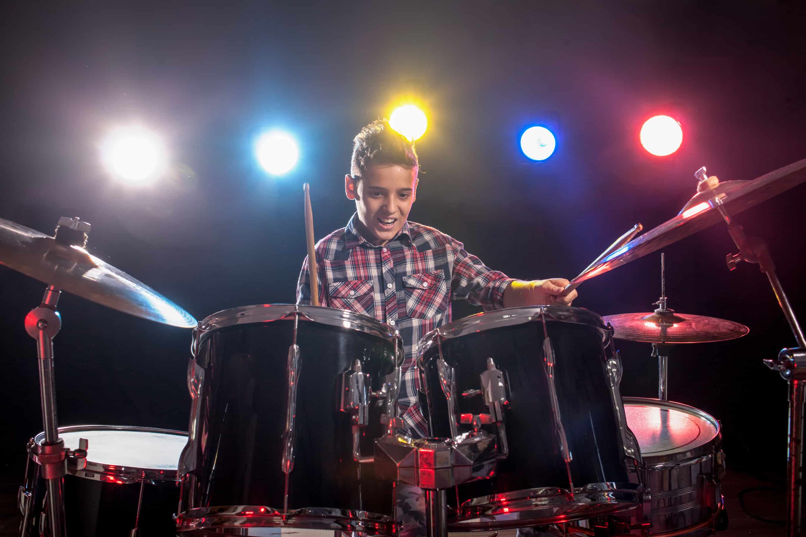 teenager playing drums