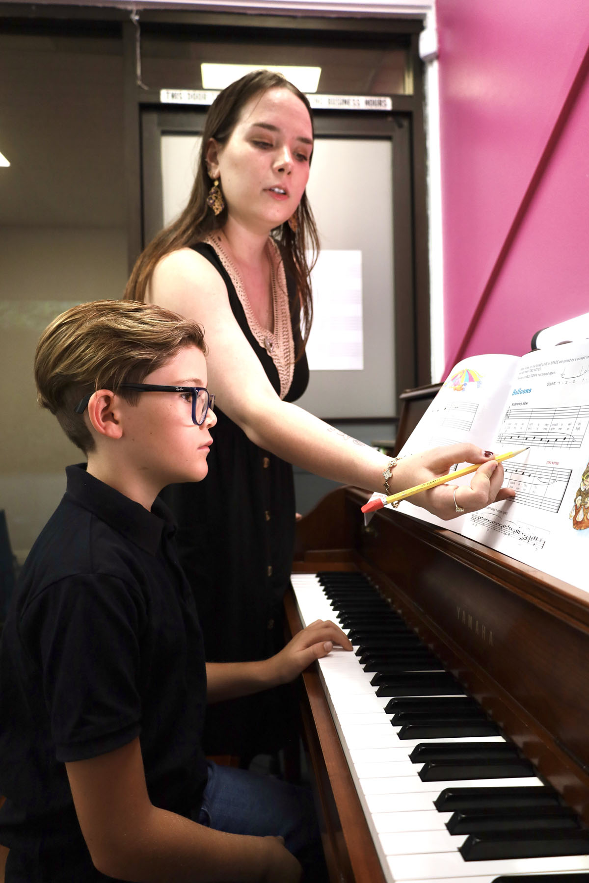 boy learning piano