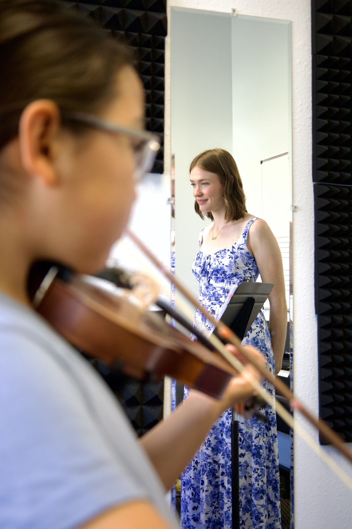 blond girl learning violin