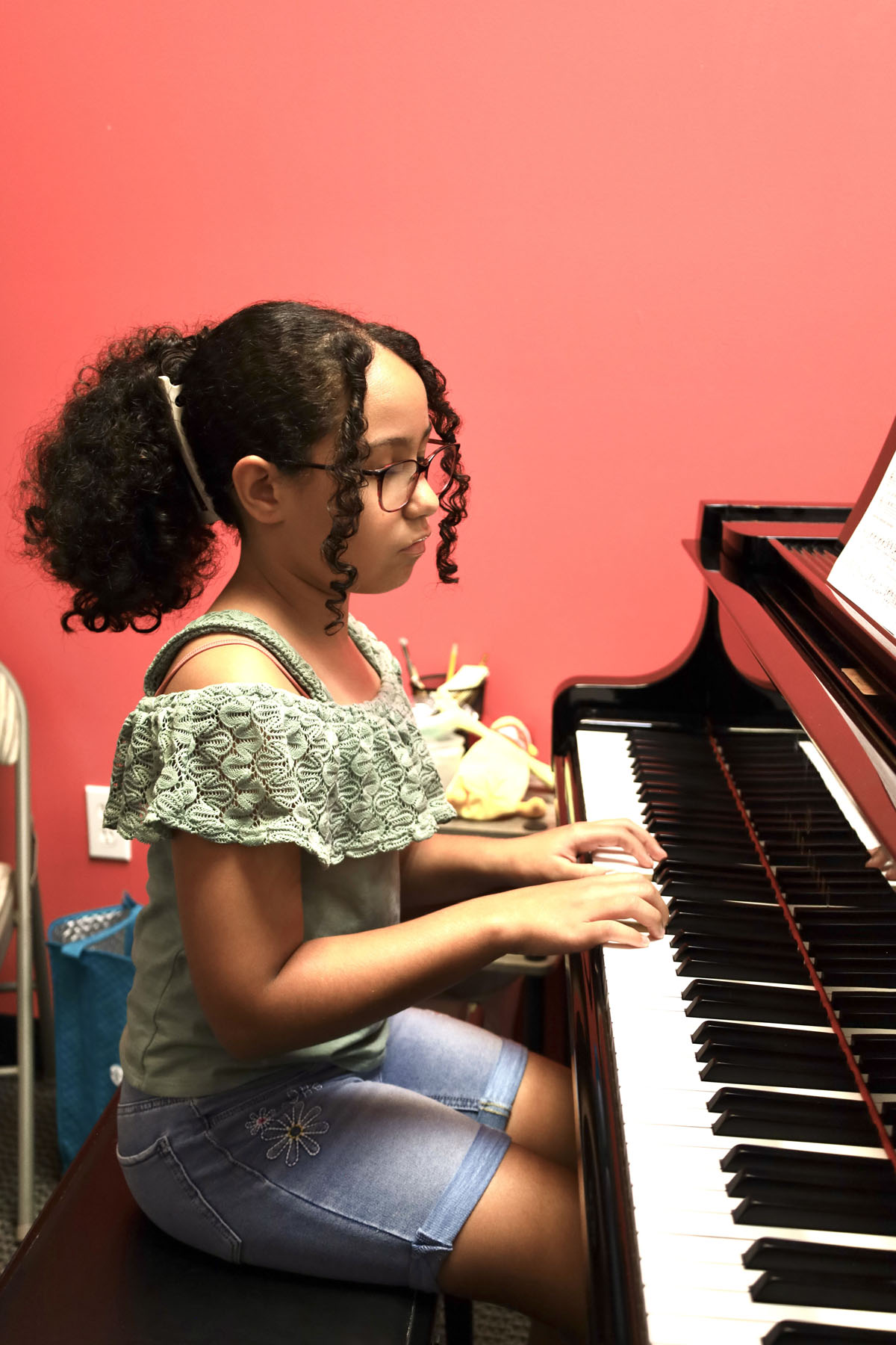 blond girl learning violin