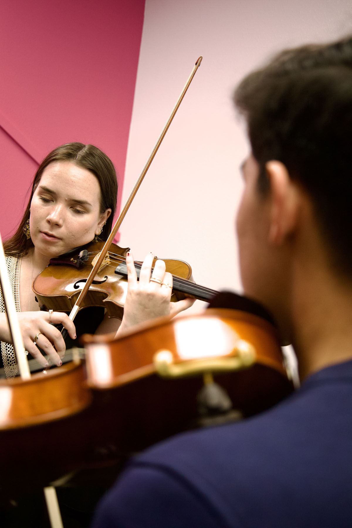 blond girl learning violin