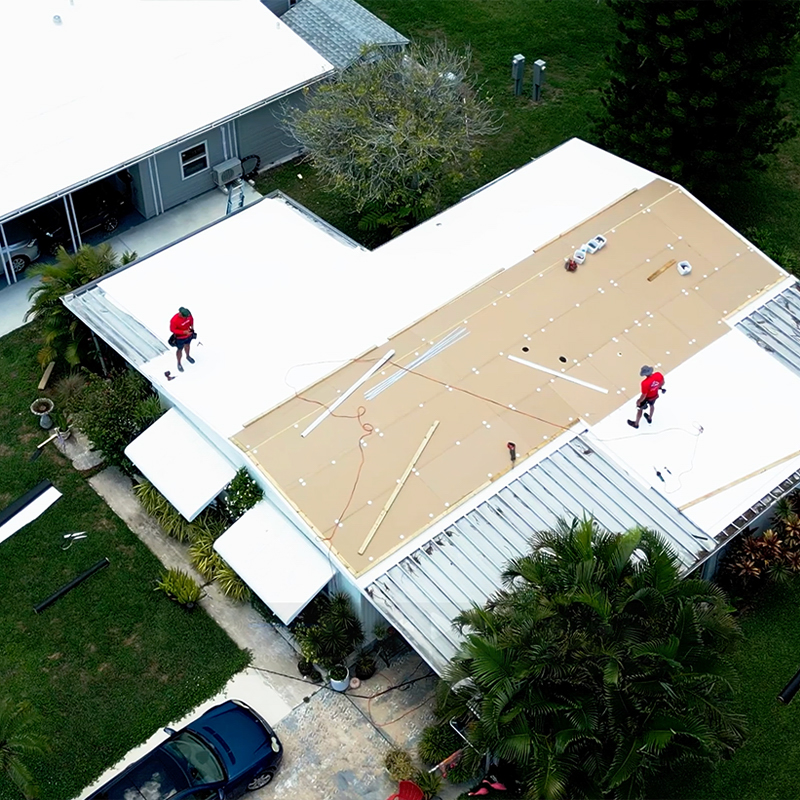 Tarpon Springs mobile home park rooftops showing mix of repaired, coated and replacement roofs