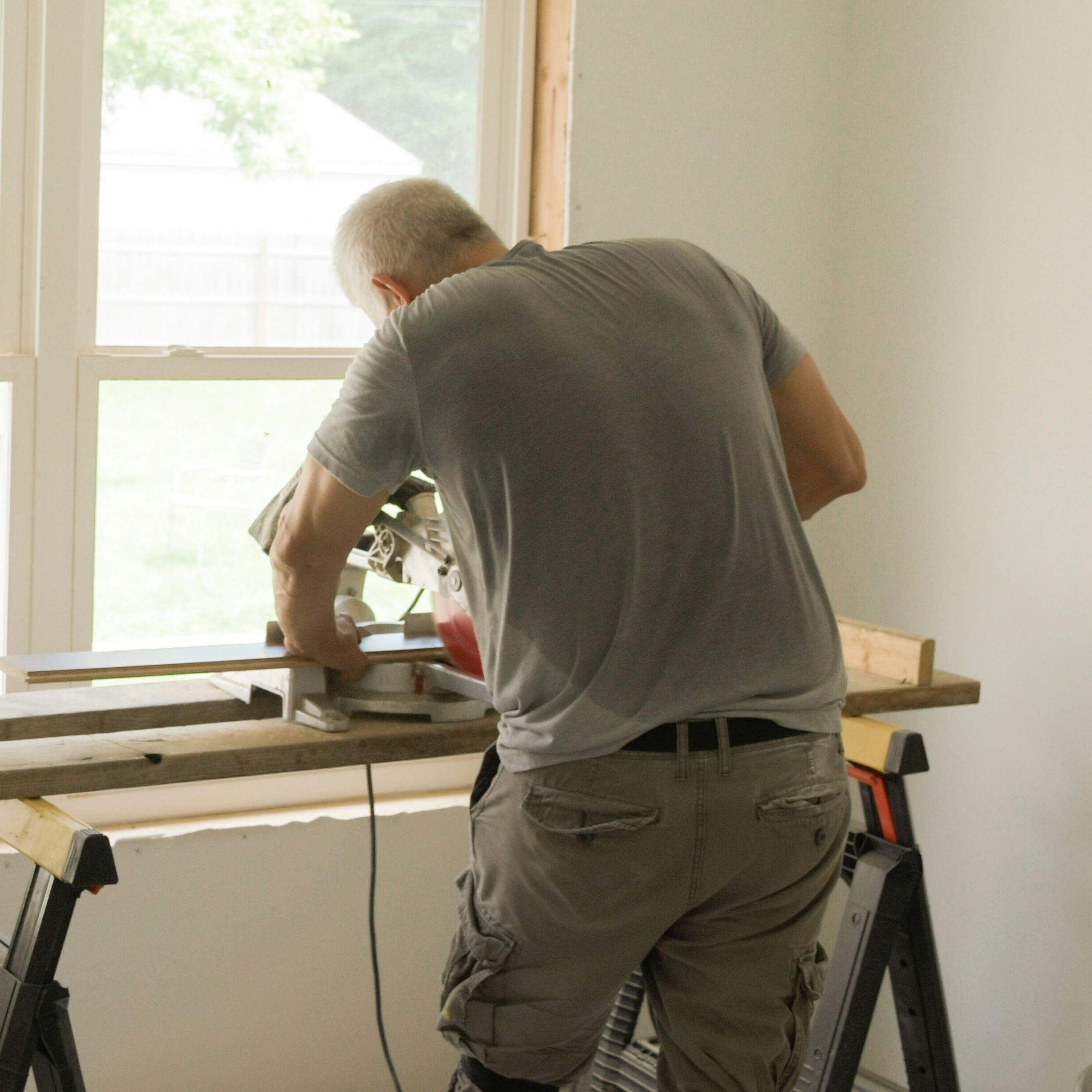 HyBar technician repairing a window screen on-site