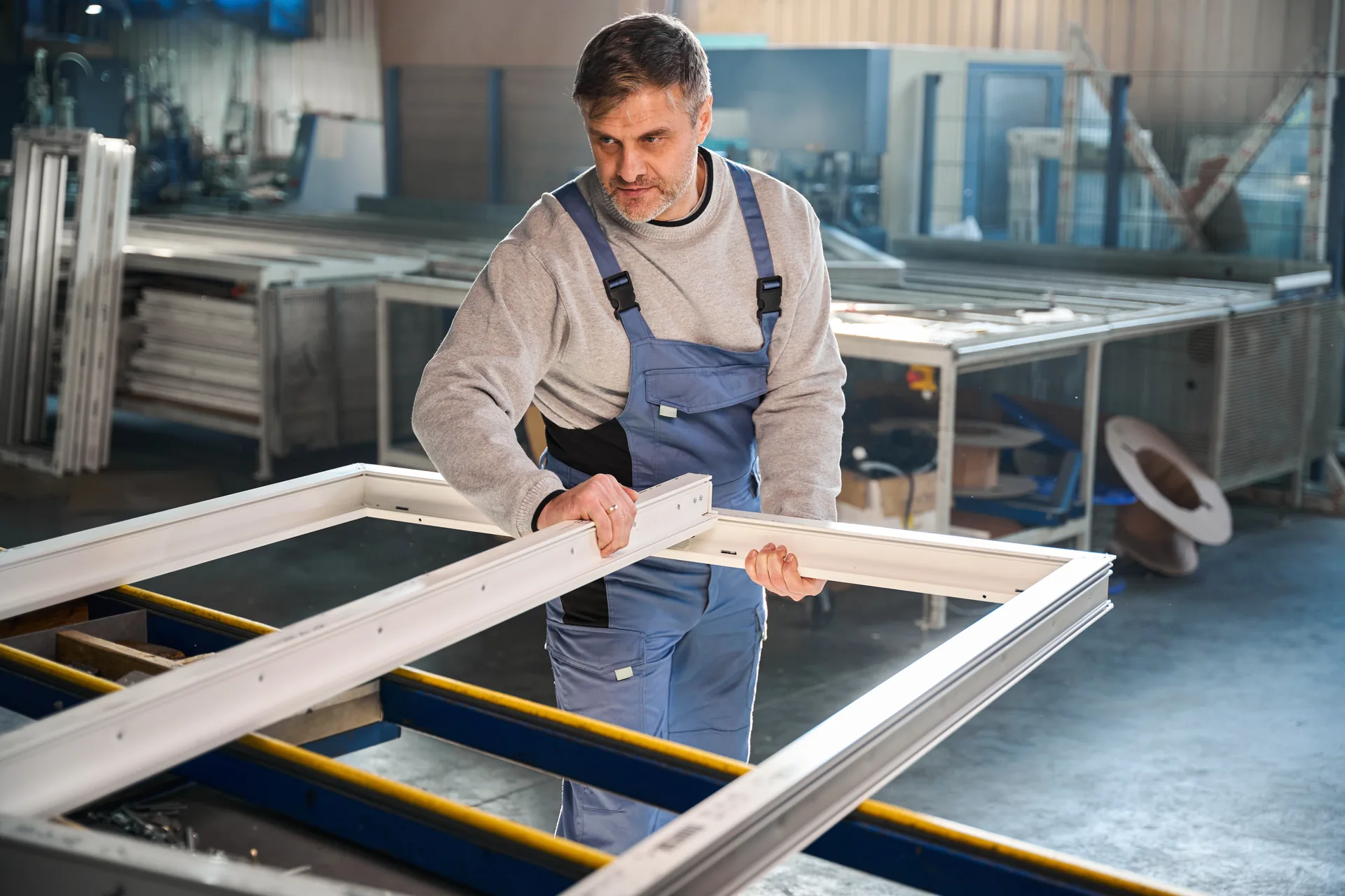 HyBar technician assembling a window frame in the workshop