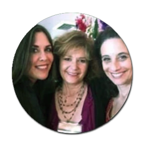 Three smiling women posing together in a student testimonial.