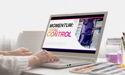 Hands on a laptop viewing four bonus modules for the watercolor course.