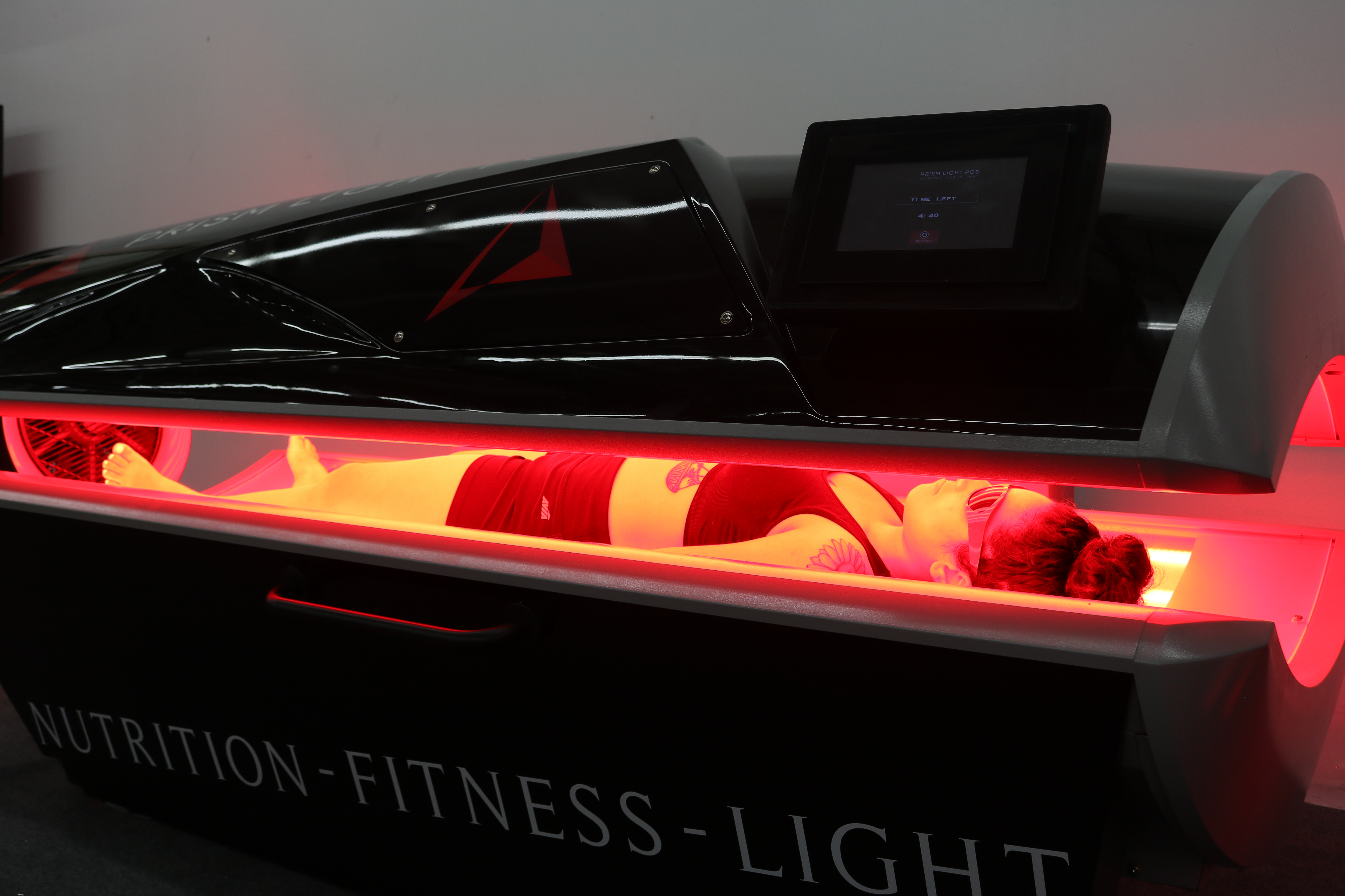 Full-body red light therapy in the Prism Light Pod