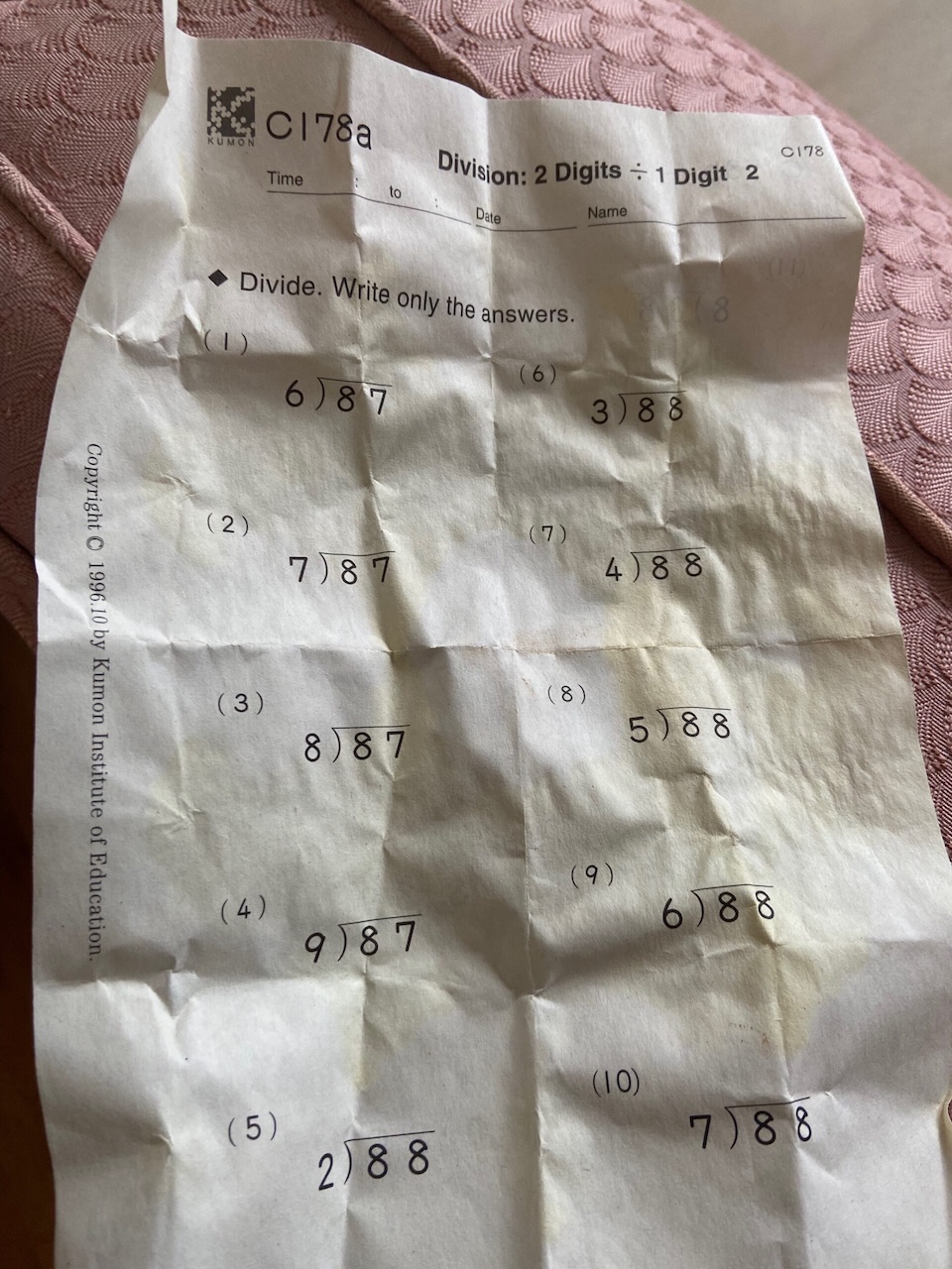 crumpled Kumon paper with math exercises