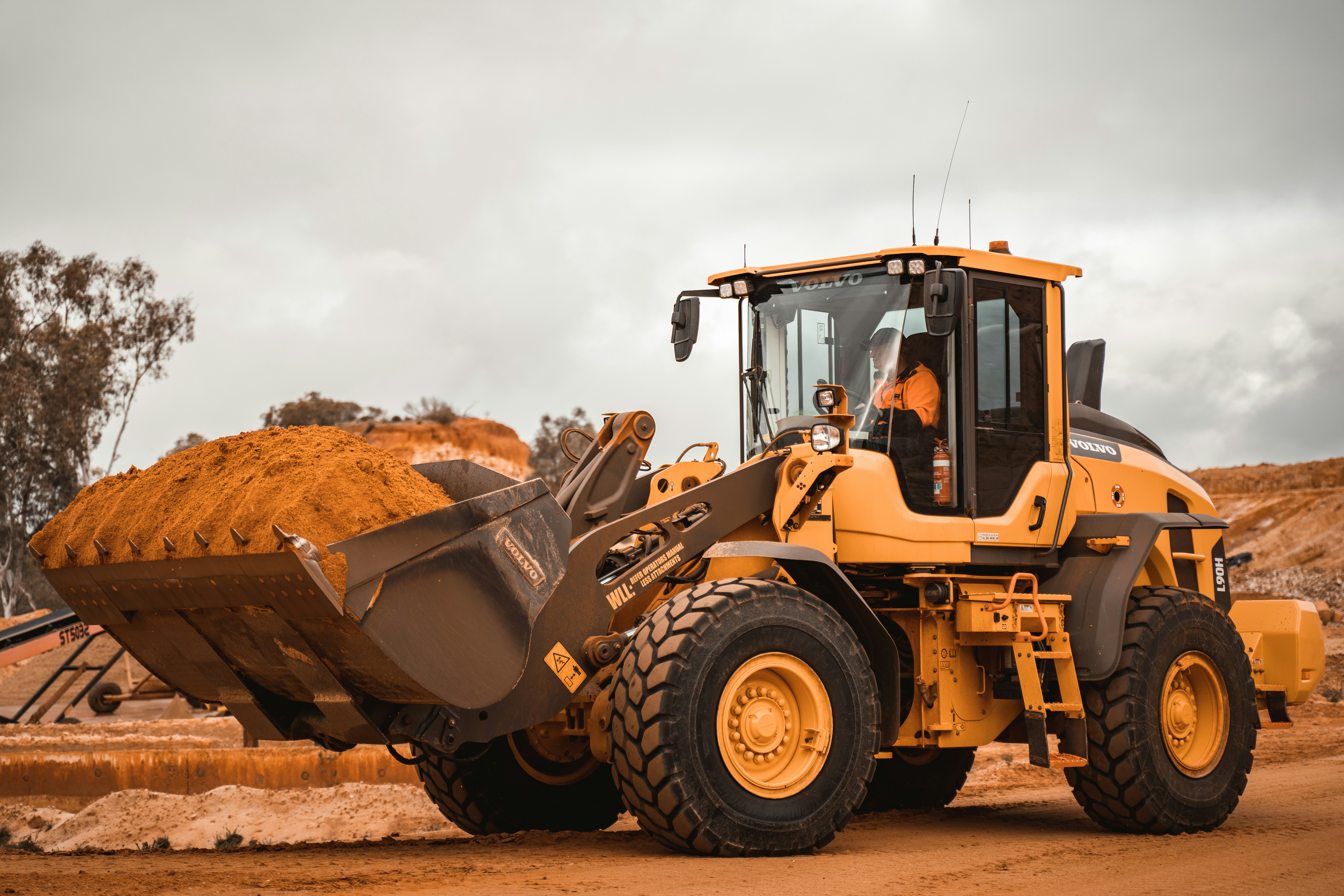 Commercial grading and site preparation equipment on a job site