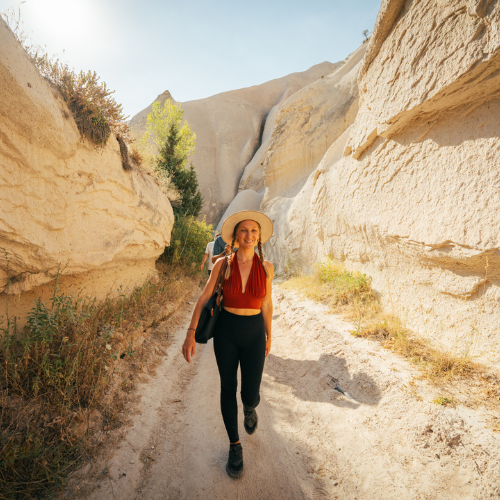 Exploring mystical Cappadocia valleys and ancient rock formations during wellness retreat