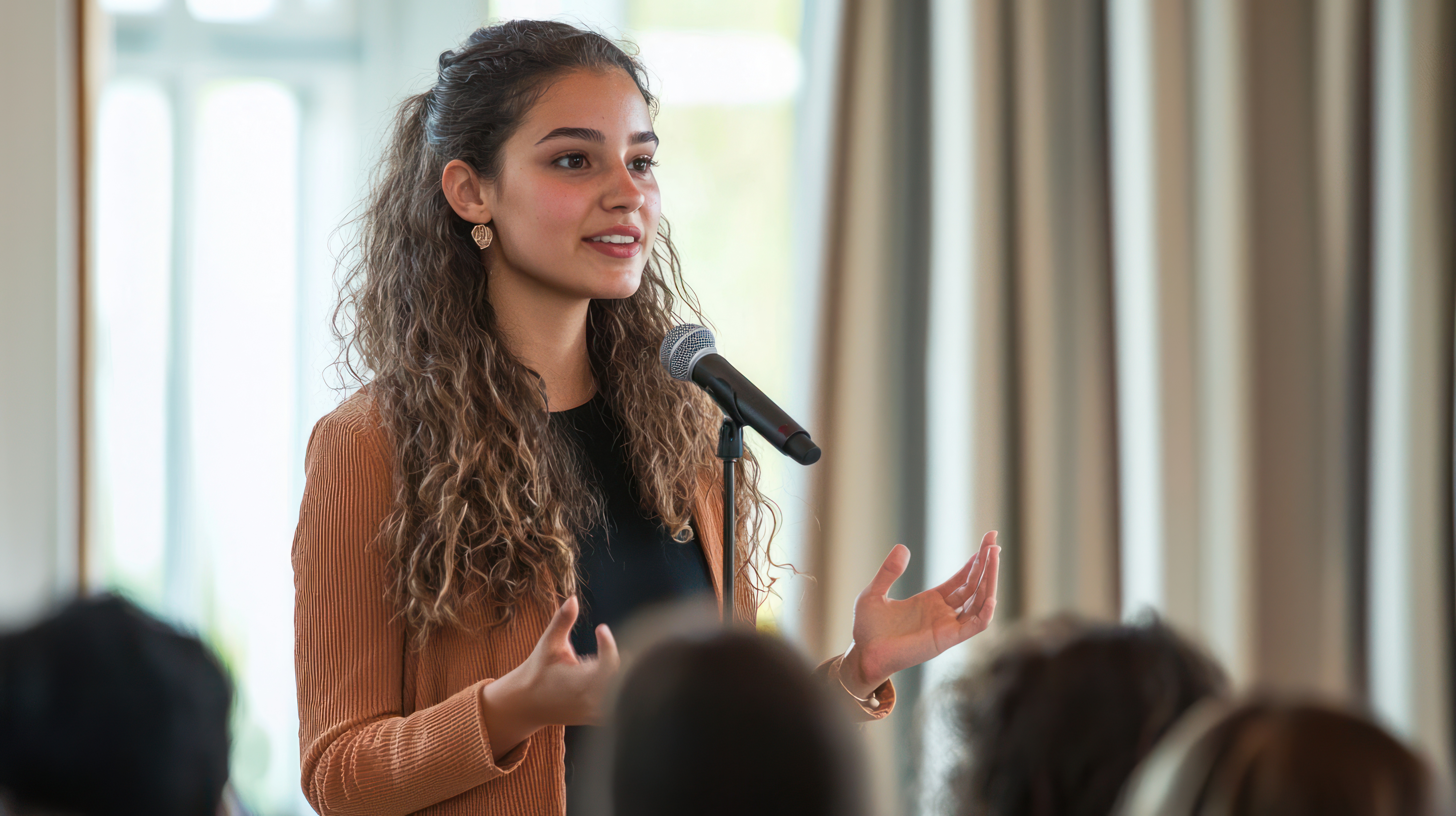Woman speaking with confidence in a meeting