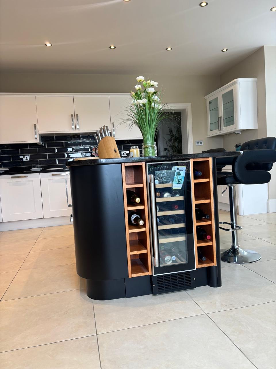 Kitchen with charcoal island after professional respraying in Jersey