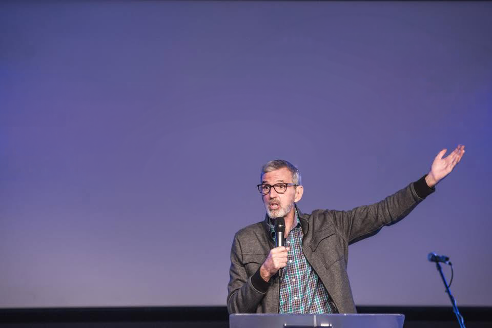 Rick Shelton preaching from Scripture