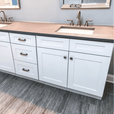 Custom bathroom vanity installation with dual sinks and elegant cabinetry