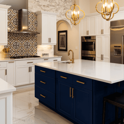 Elegant new kitchen with navy cabinets, gold accents, and marble countertops