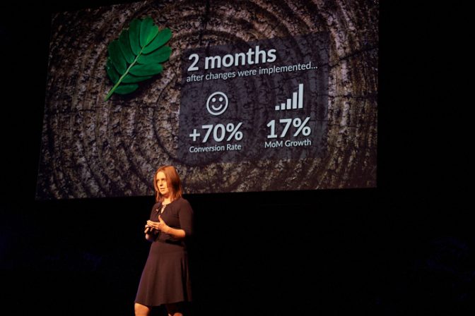 Selena Woodward on stage presenting Edufolios growth results