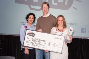 Selena Woodward receiving a pitch competition cheque for Edufolios