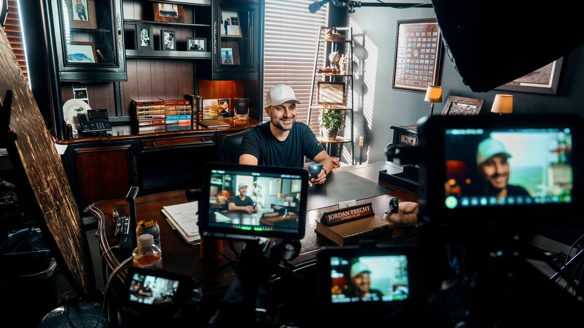 Jordan Sellers on set during a client video shoot in an owner's office