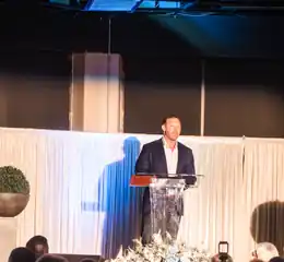 Speaker on stage at a Men for Life event