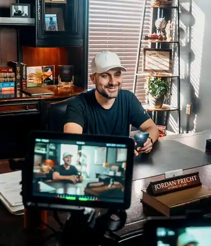 Jordan filming a client in his law office