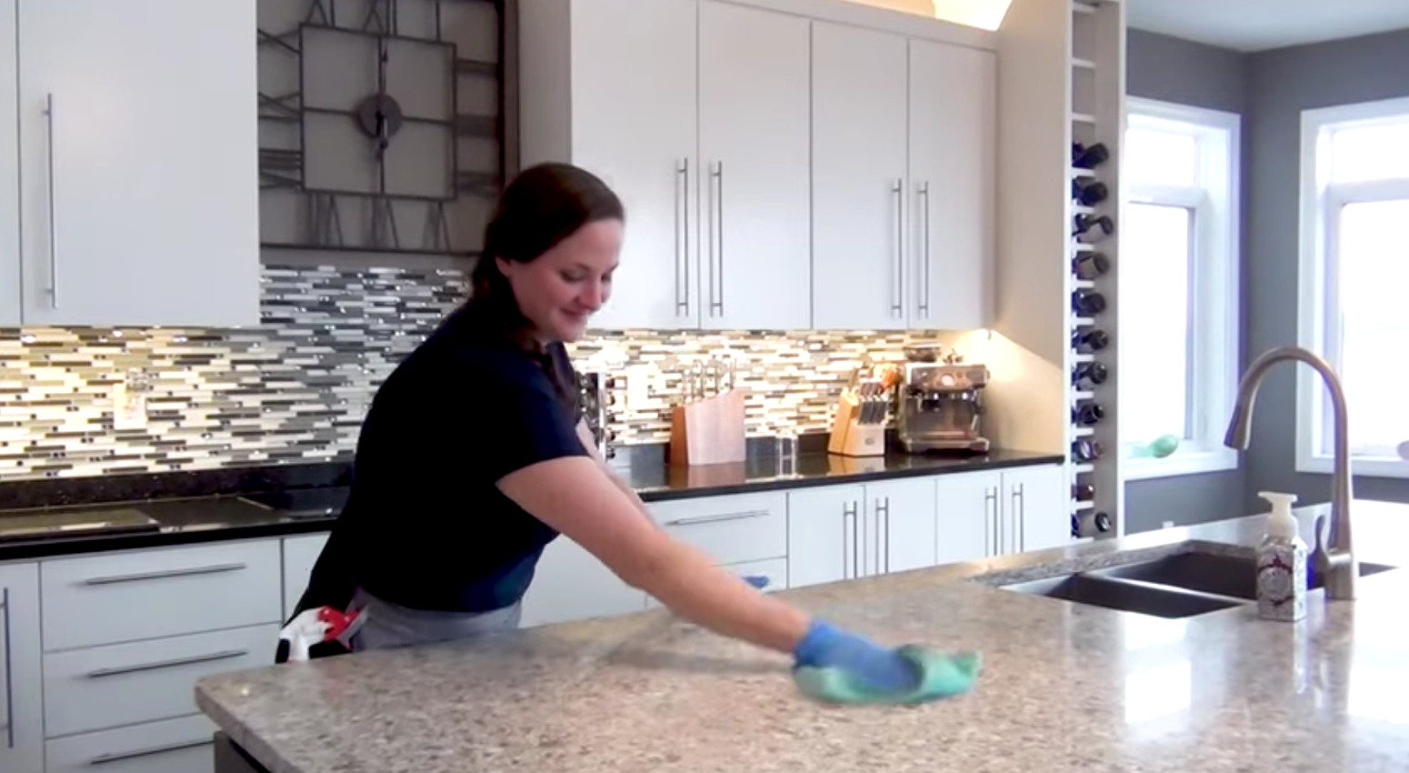 cleaner cleaning granite island