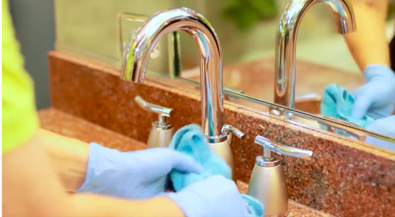 maid cleaning bathroom faucet maid cleaning bathroom faucet
