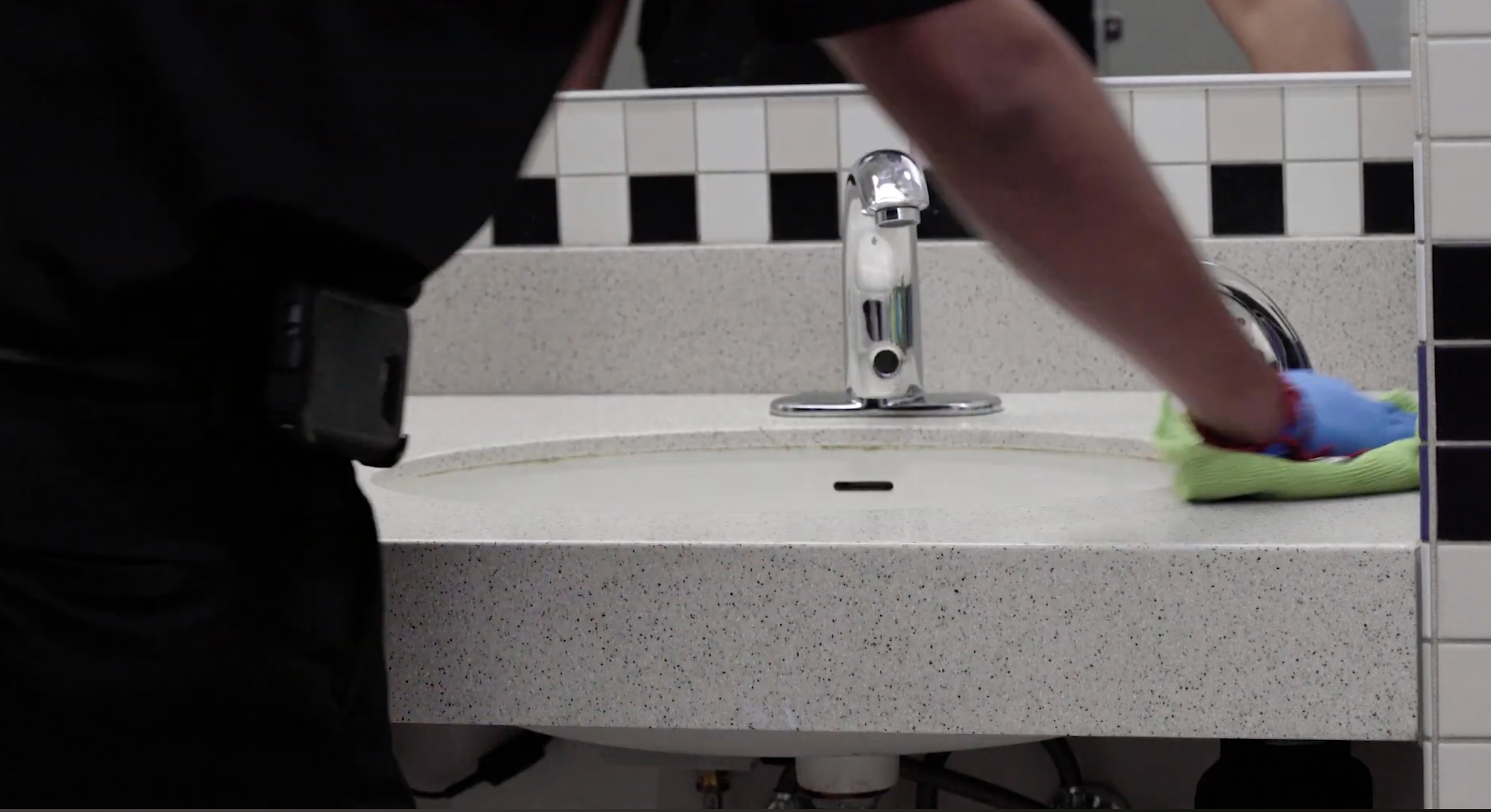 janitor deep cleaning restroom
