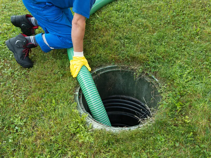 Eastside Repipe plumber running cable auger for drain cleaning in a Bellevue WA home