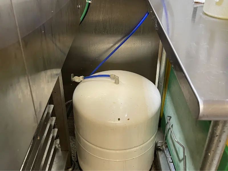 Eastside Repipe And Plumbing technician installing a tankless water heater as part of specialized plumbing services in Bellevue WA Eastside Repipe And Plumbing technician installing a tankless water heater as part of specialized plumbing services in Bellevue WA