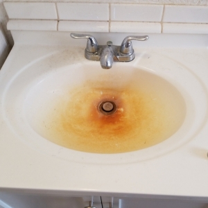Bathroom sink before professional cleaning