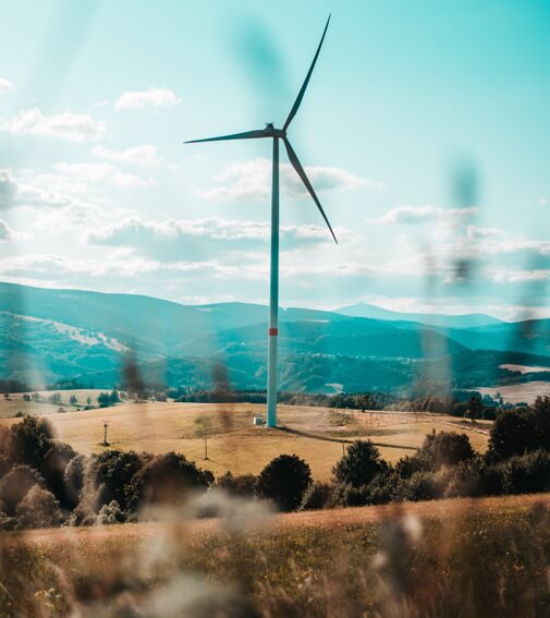 Wind turbines producing renewable energy in the countryside