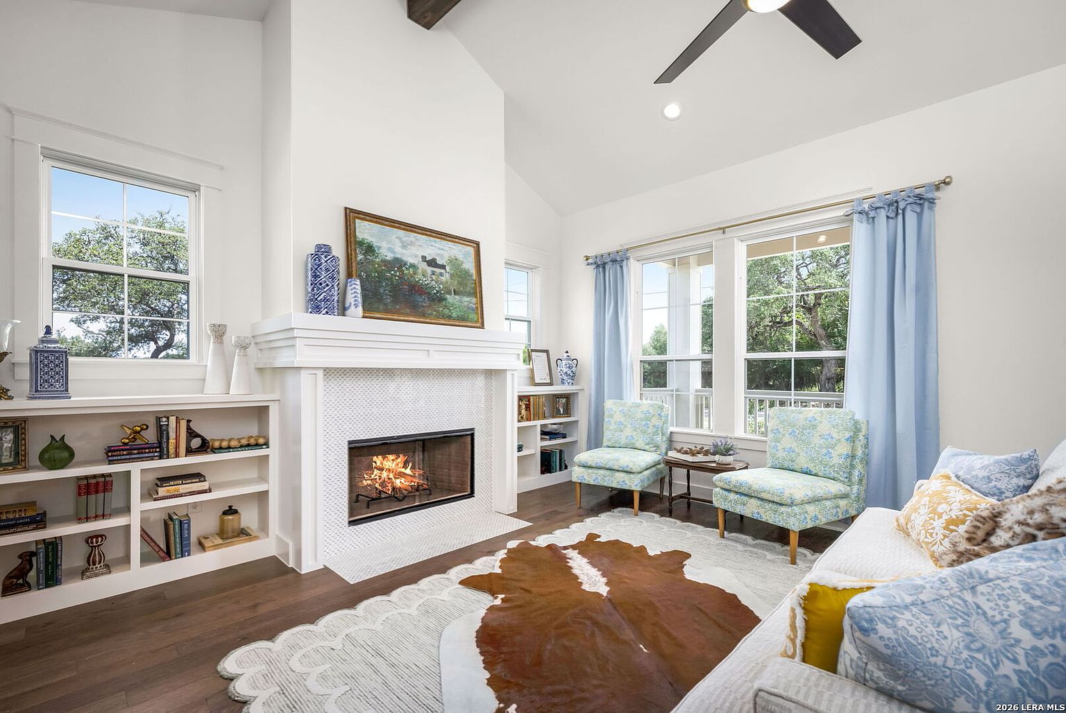 Living room with fireplace and built-in shelves