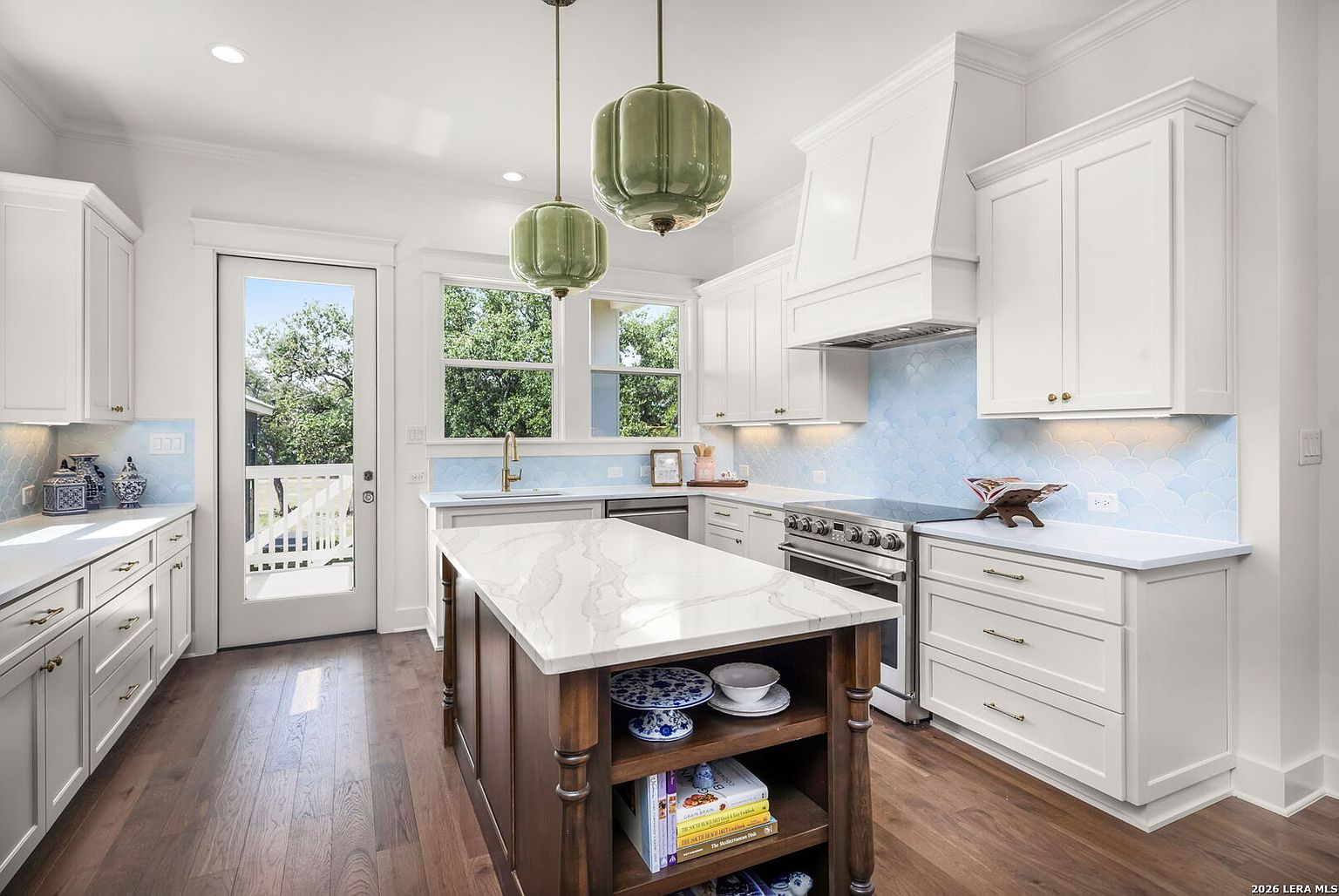 Kitchen with island and pendant lights
