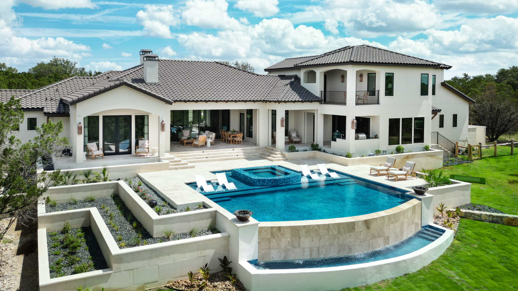 G. Morris custom home exterior with infinity pool