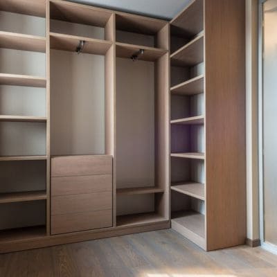 Custom wood closet with open shelving and drawers