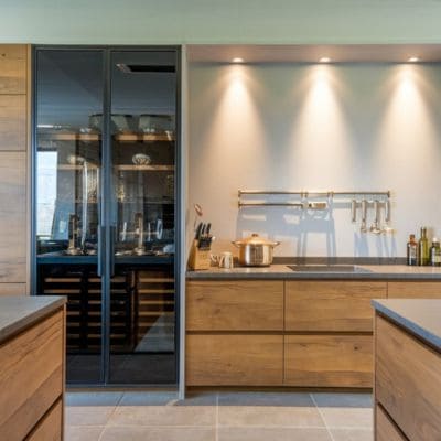 Modern kitchen with custom cabinetry and lighting accents