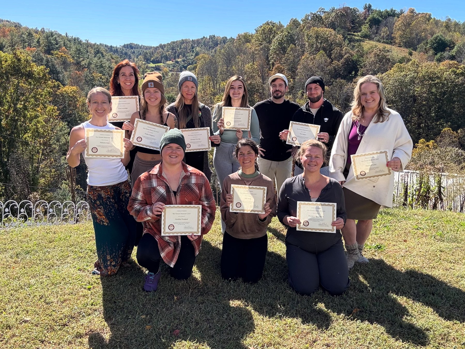 Graduating class with certificates