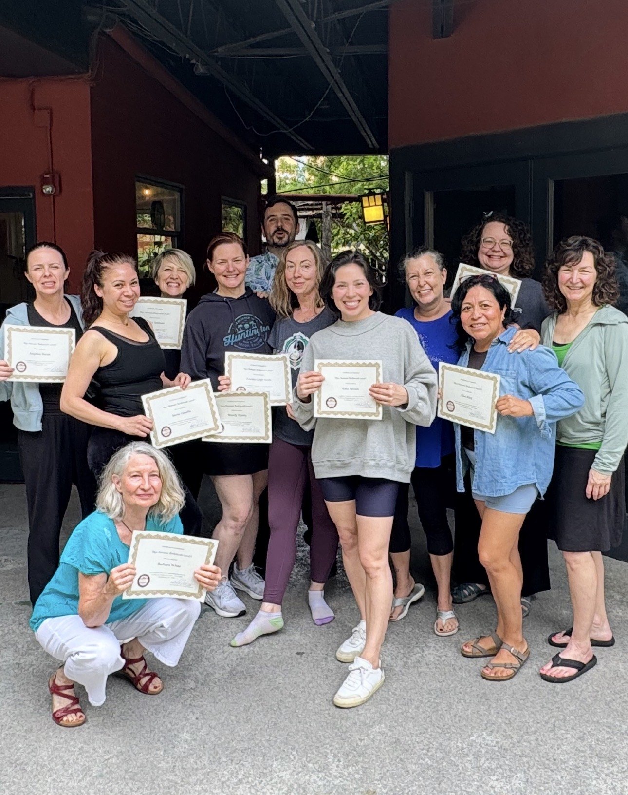 Graduating class with certificates