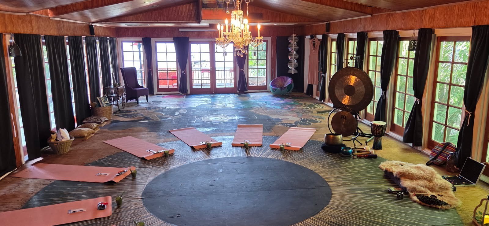Practice room set with mats and a drum at Moi Space