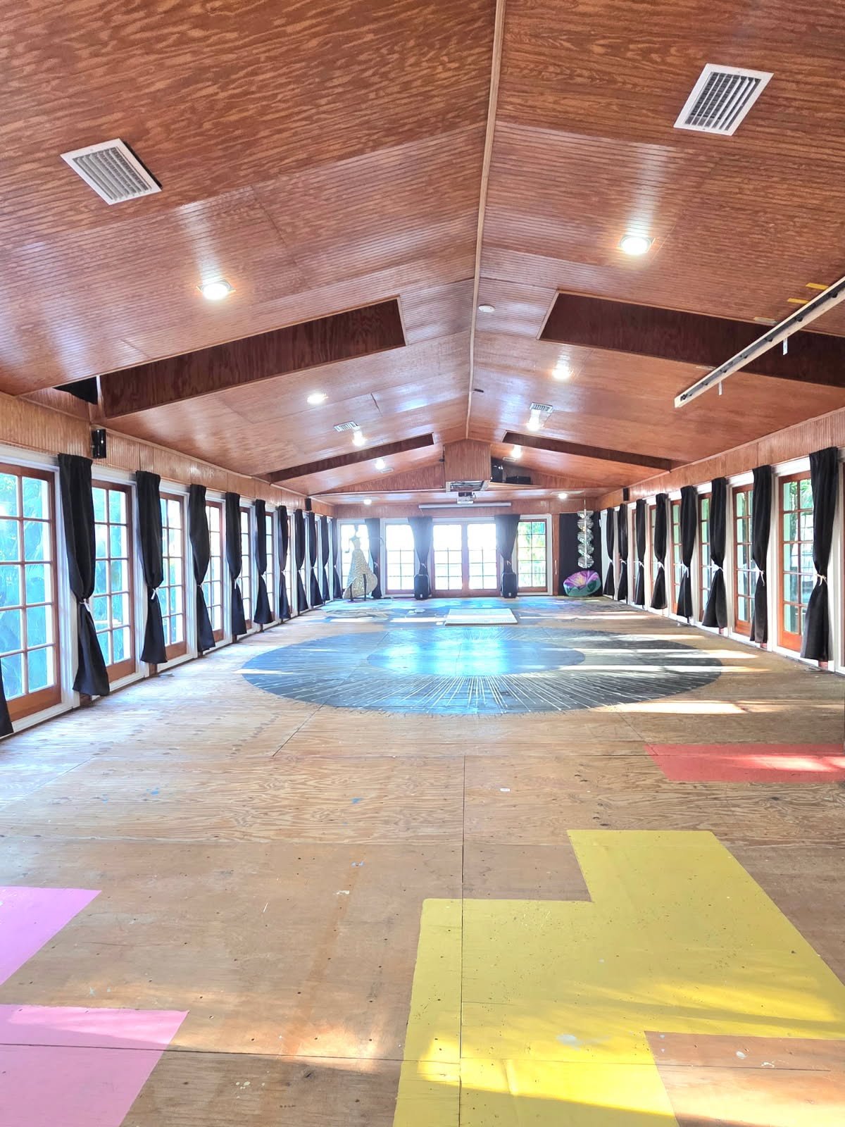 Light-filled practice room with wood ceiling at Moi Space