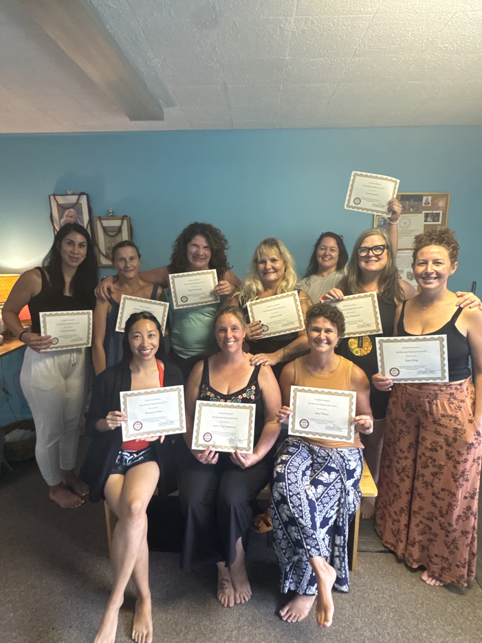 Graduating class with certificates