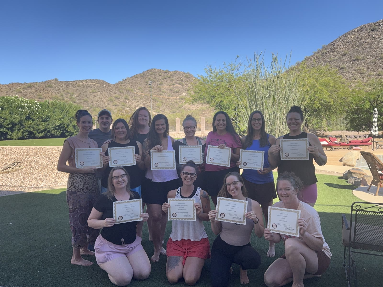 Graduating class with certificates
