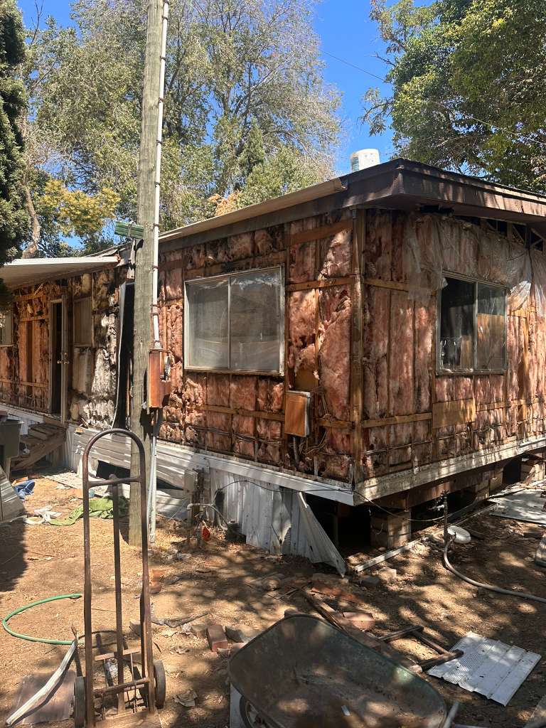 Distressed home exterior before