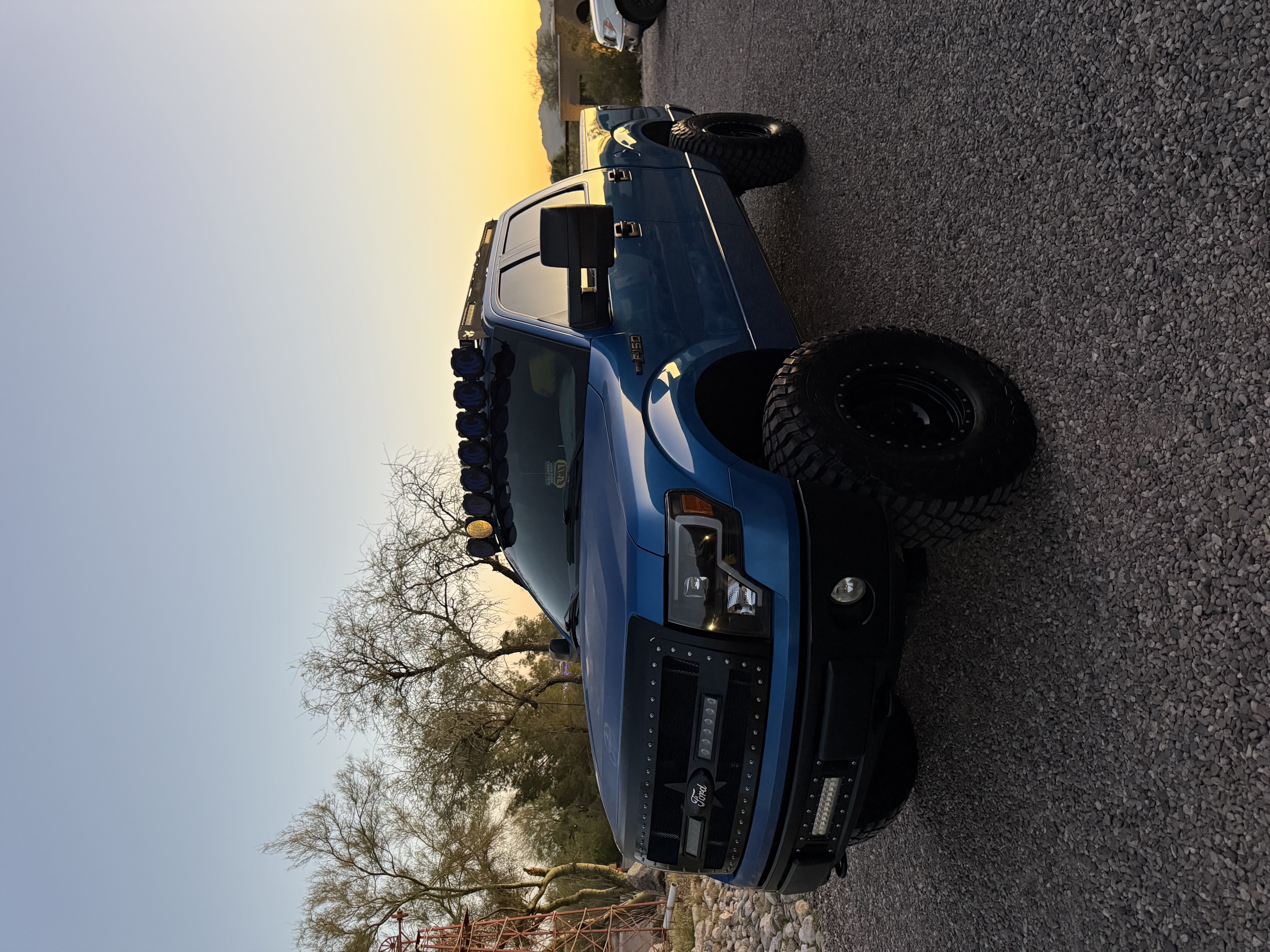 blue truck at sunset