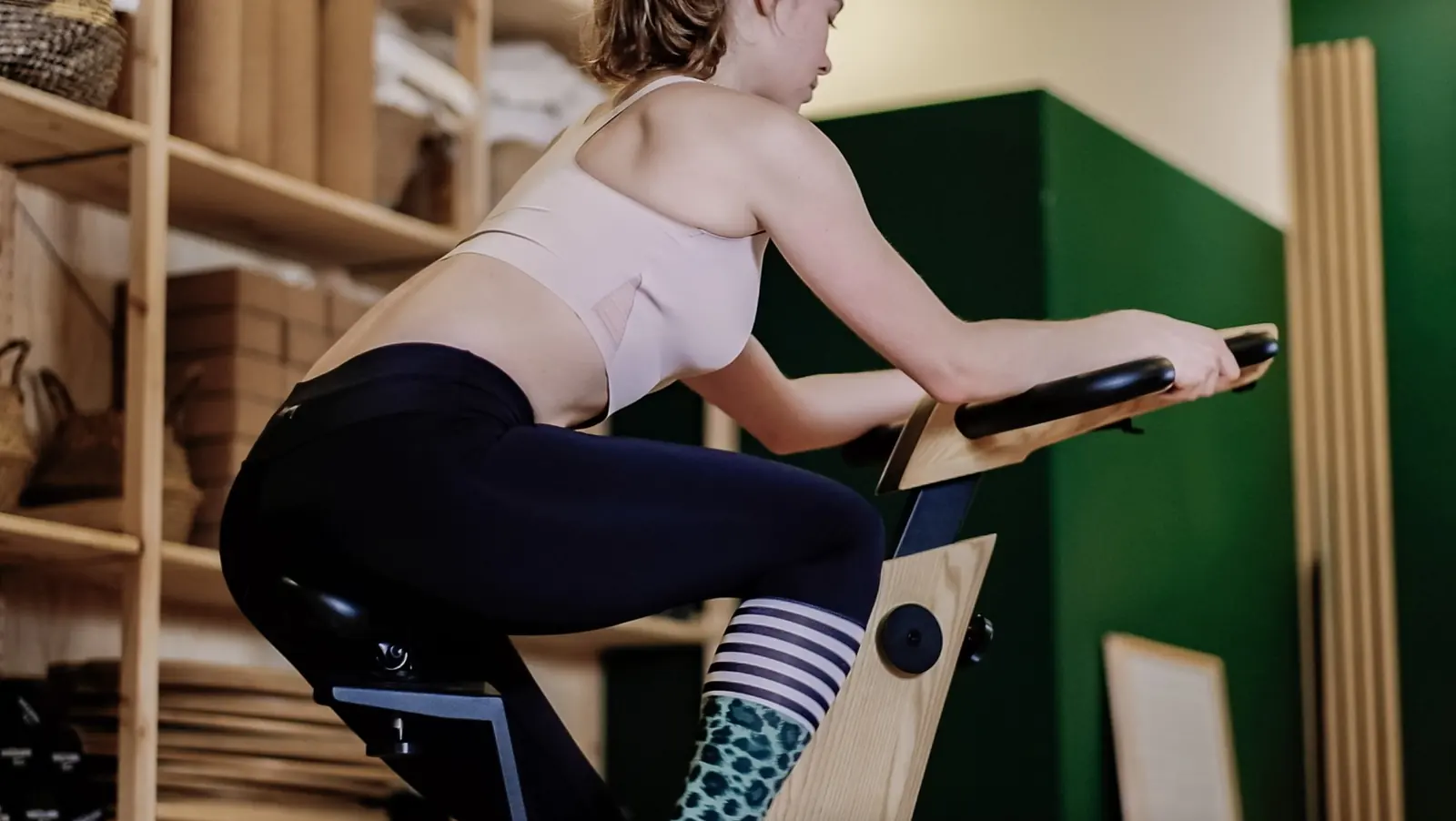 A woman training hard on an exercise bike