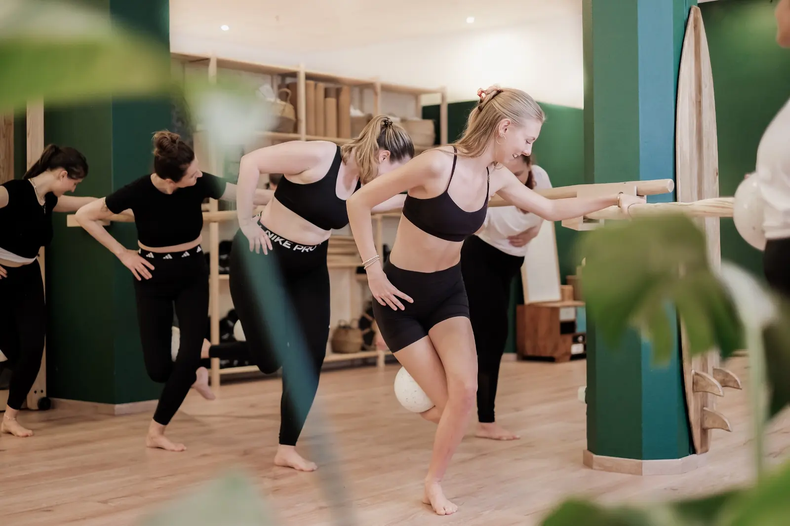 A group of women training together at the barre in a class at The Good Gym