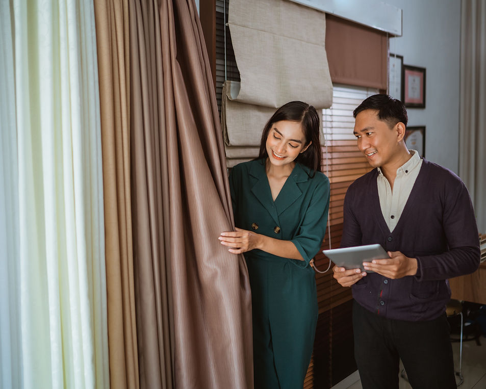 Woman showing curtains to a man