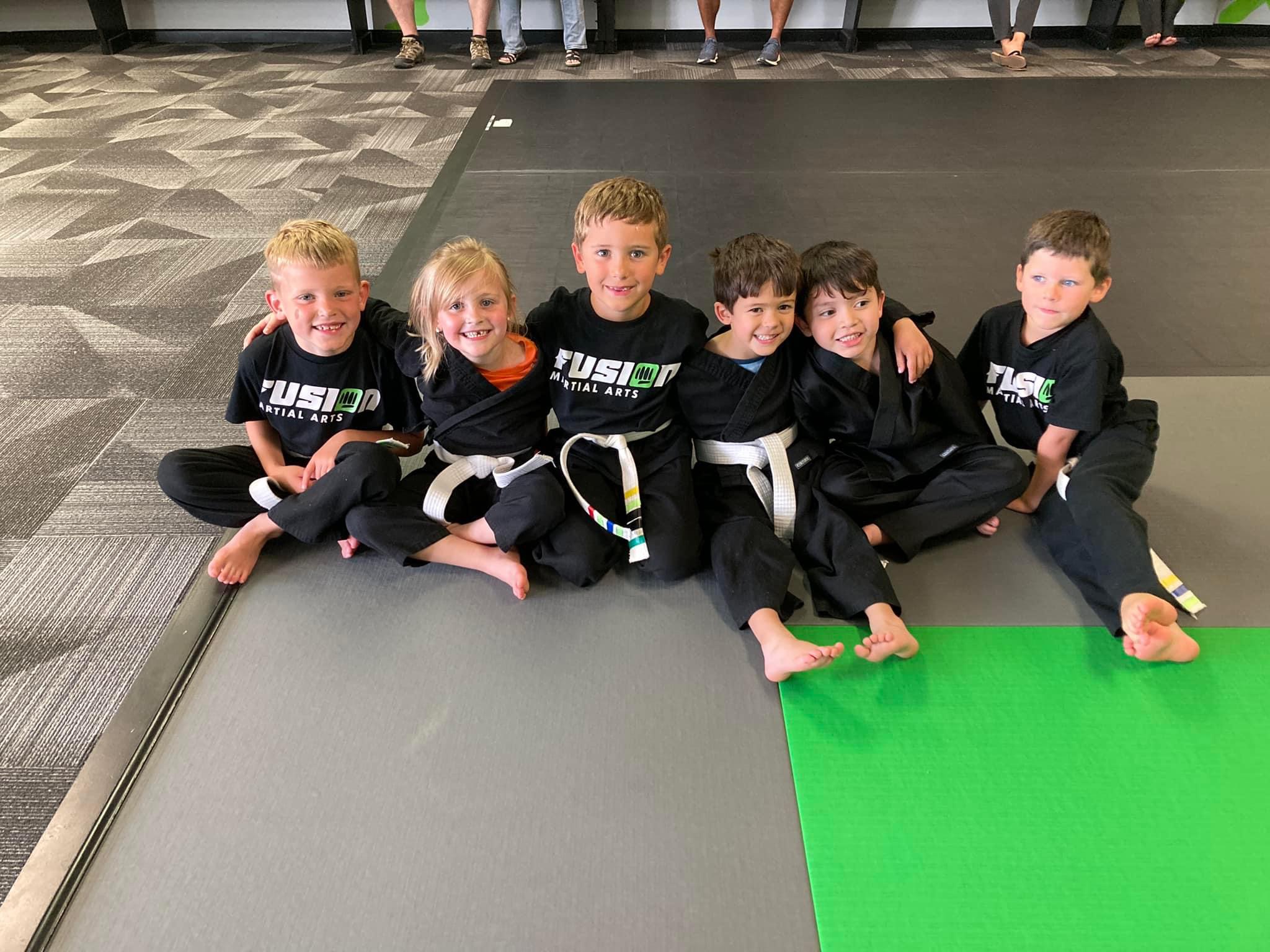 Kids class gathered on the mats at Fusion