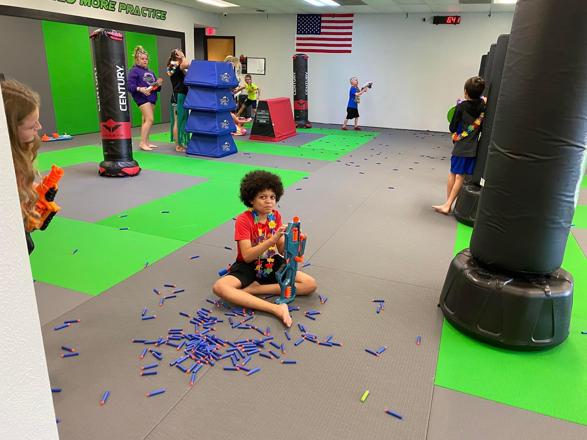Kids playing a martial arts game in class